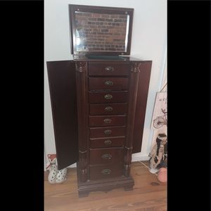 8 front drawer Jewelry stand.. 2 side doors for necklaces and top with mirror.